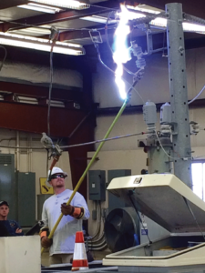 Dawson PPD lineman Josh Thompson demonstrates an electric arc at 7,200 volts during a safety demonstration for the North Platte Volunteer Fire Department.