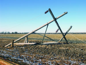 A transmission pole lies splintered on the ground after the 2006-2007 ice storms swept through Dawson PPD’s territory. It was part of a 14 mile stretch north of Kearney that had to be rebuilt.