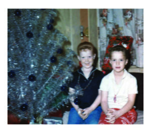 General Manager Gwen Kautz’s (right) holiday memories include her sister, Dawn, and the beauty of a stylish aluminum Christmas tree.