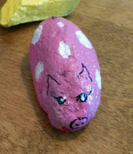 Gothenburg resident Mary Sanders Donahue painted a rock to look like a pig and hid it at a local park. A Colorado resident found the pig rock and took it home. In exchange, she left behind a rock painted like the Colorado state flag. Photo courtesy Mary Sanders Donahue.