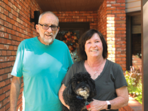 Neal and Joyce Boyd with their dog, Max.