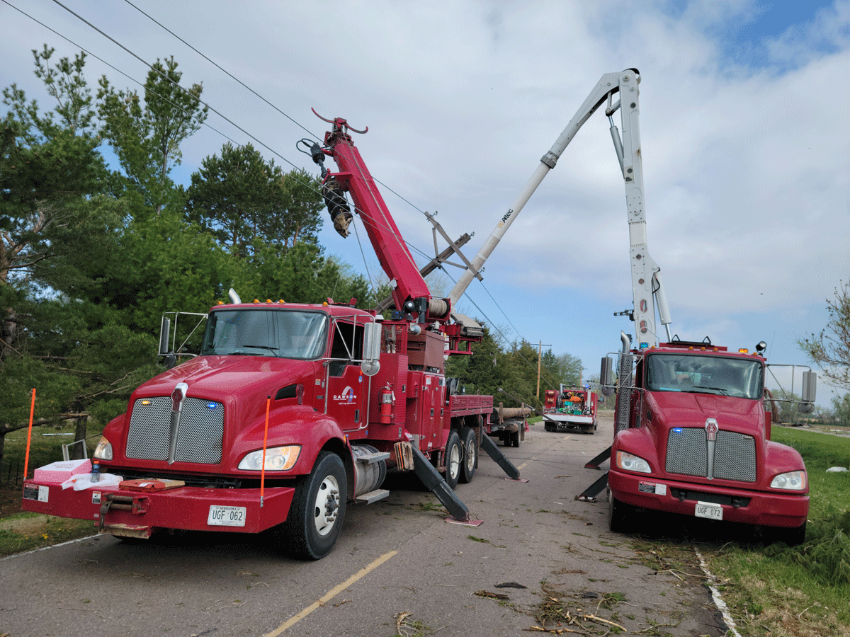 Dawson PPD lineworkers make repairs to broken utility poles after a tornado swept through the Johnson Lake, Nebraska, area on May 5, 2023.
