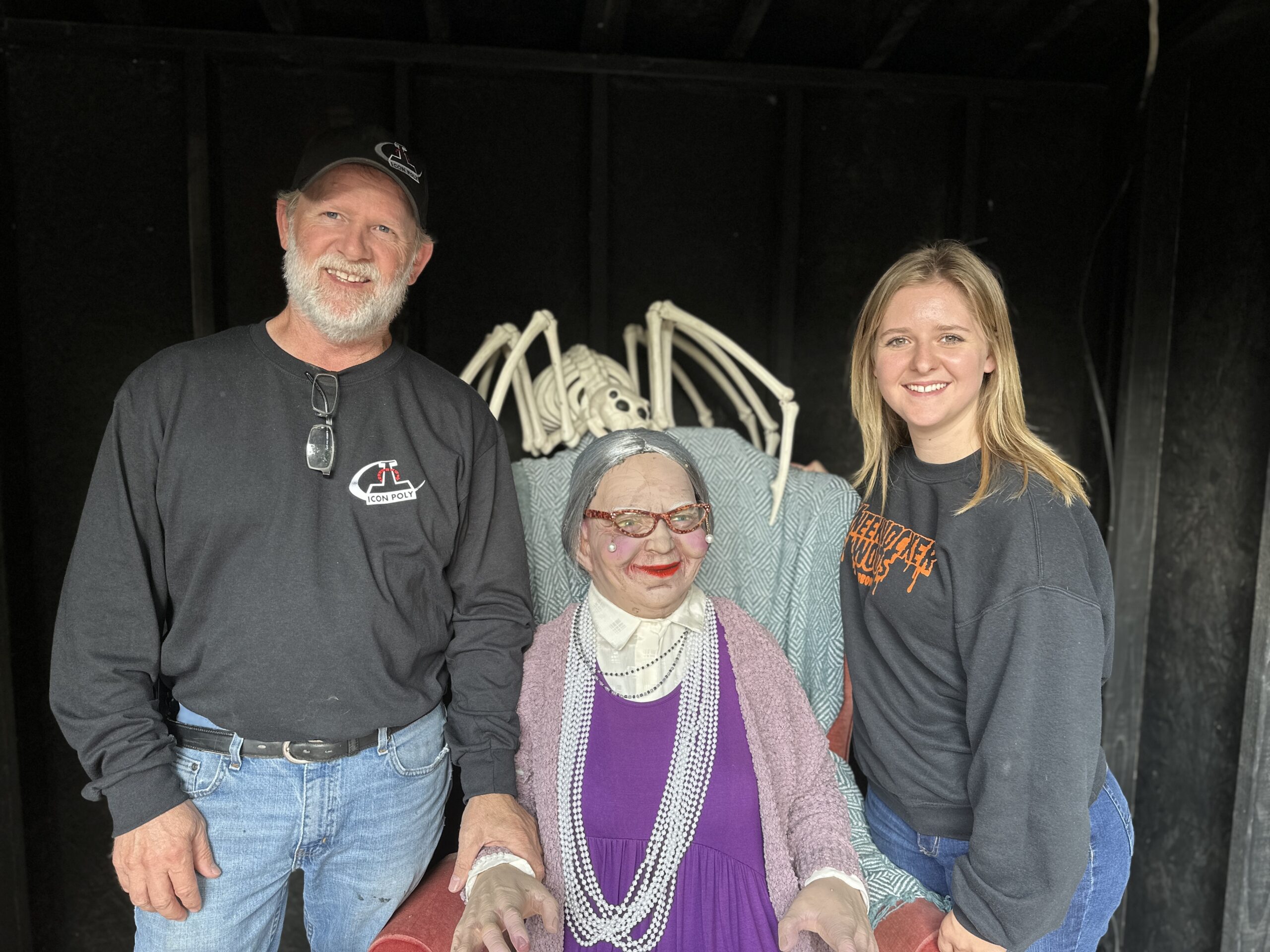 KneeKnocker Woods owners and father-daughter duo Kyle Vohland and Kylee Olson stand by Grandma Grimm, an animatronic character.