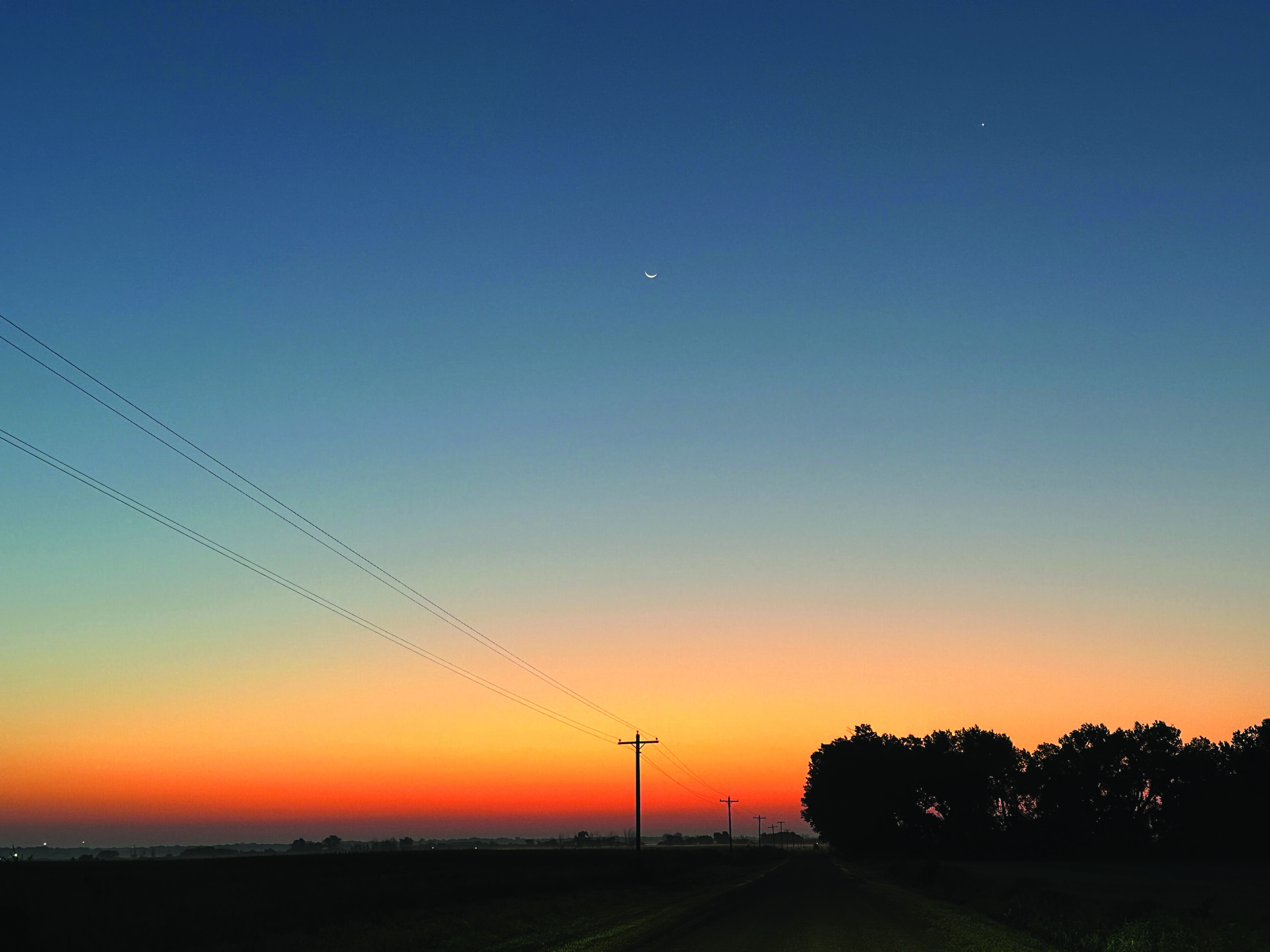 Dawson PPD power lines silhouetted at sunrise. September 2023.